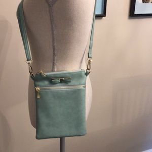 Aqua cross body purse with gold accents